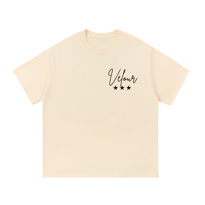 ODMPOD F3THY Serene Washed Oversized Tee in apricot, pink, and blue with a relaxed fit and soft, faded fabric.