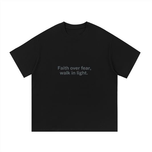 ODMPOD F3THY risen Tee featuring a bold graphic design on a black t-shirt, casual streetwear style.
